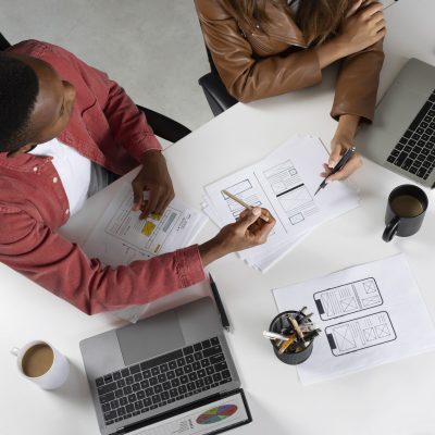 top-view-people-working-with-laptops
